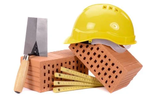 House construction with brick, tools, plan and model house house construct... Stock Photos