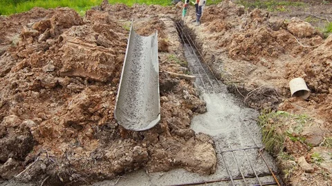 House construction, Foundation pouring, liquid cement Stock Footage 90467128