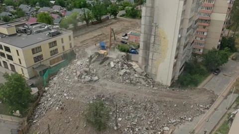 House damage excavator heavy work destruction tractor building destroy ear Stock Footage 247054049