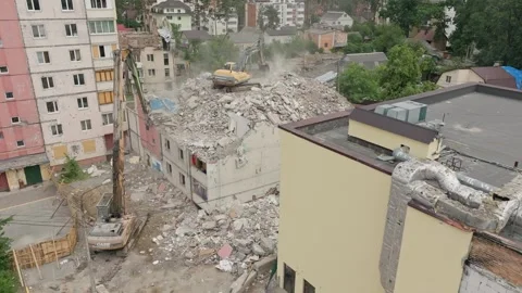 House damage excavator heavy work destruction tractor building destroy ear Stock Footage 247054887