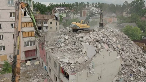 House damage excavator heavy work destruction tractor building destroy ear Stock Footage 247056739