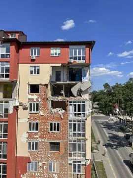 A house destroyed by a rocket. A rocket hit a house. Russian-Ukrainian war. Stock Photos