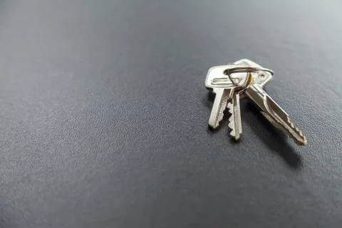 House door keys on a table. Copy space. Keys concept. Stock Photos