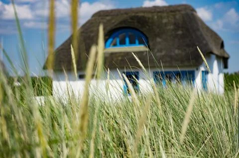 House in the dunes Stock Photos