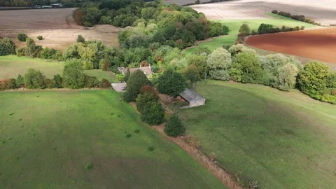 House estate with big plot of rural land, agriculture field english Video stock 319818022