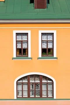 House facade with windows. Stock Photos