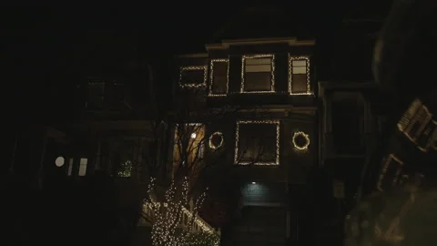 House facade with windows surrounded by garlands Stock Footage 334031151