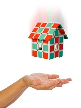 The house is falling down to human hands Stock Photos
