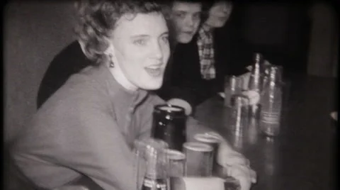 House father at fraternity house pours beer 1950s vintage film home movie 3174 Stock Footage 59105451