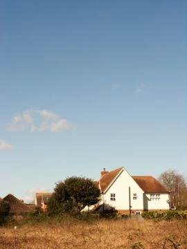 House in Field Stock Photos