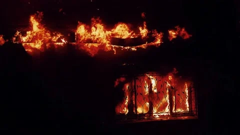House fire. the building is on fire burning a danger smoke sparks. fire safety Stock Footage 197066614