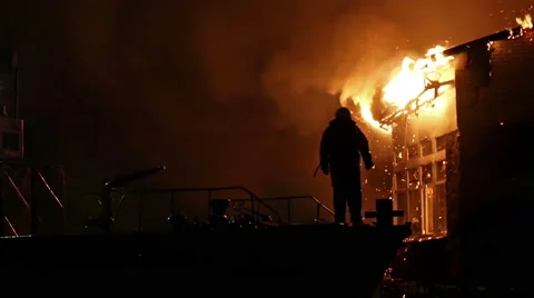House on fire. Conflagration. Fireman fights fire. Stock Footage 58231613