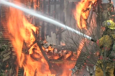 House fire with debris falling 库存影片 129360