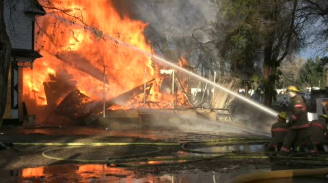 House fire with falling debris Stock Footage 293327