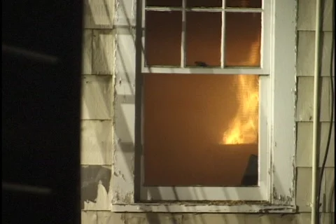 House on Fire with Fireman Inside Stock Footage 297733