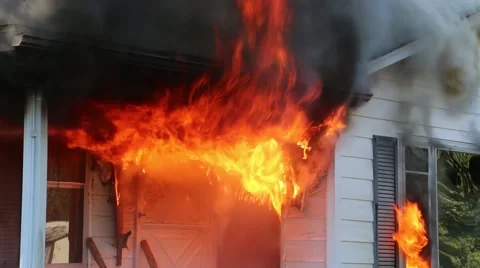House fire fully involved.  Front porch view Video stock 57095126
