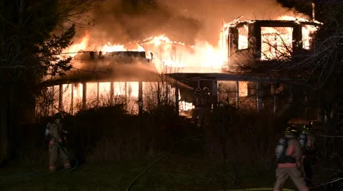 House Fire With Heavy Flames &amp; Multiple Firefighters Stock Footage 59868123