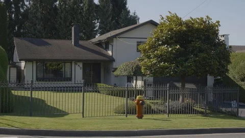 House with fire hydrant at front 스톡 동영상 118266295