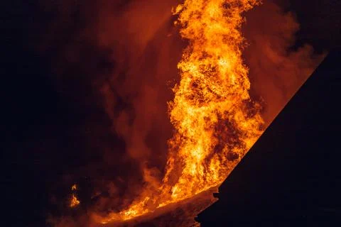 House on fire at night. Topics of arson and fires, disasters and extreme even Stock Illustration