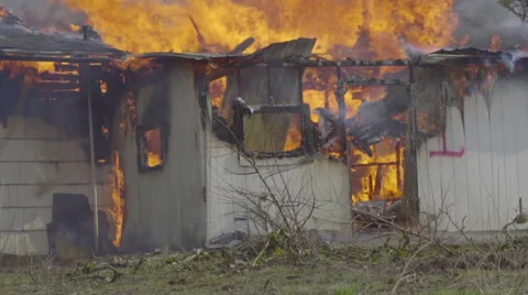 House on fire seen from a distance Stock Footage 61175054