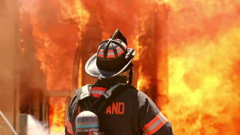 House in Flames with Fireman 動画素材 197447427