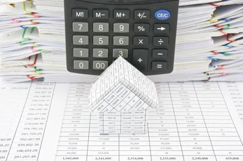 House in front of calculator Stock Photos