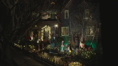 House front decorated for Christmas with light garlands Stock Footage 334031127