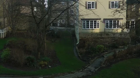 House with garden steps leading down Stock Footage 104350395
