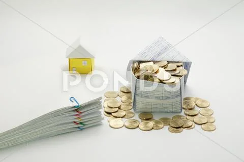 House of gold coins and pile overload document Stock Photos