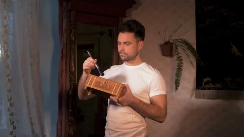 The house guy does the restoration of his antiques Stock Footage 106305287