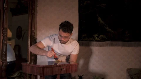 The house guy does the restoration of his antiques Stock Footage 106392211