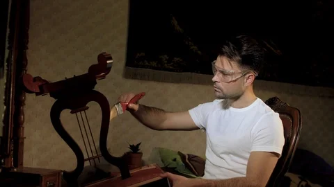 The house guy does the restoration of his antiques Stock Footage 106478181