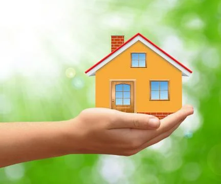 The house in hands Stock Photos