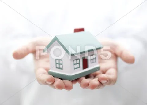 House in hands. Shallow DOF Stock Photos