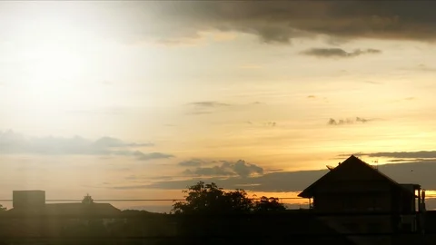 The house has a sunset in the back and light coming out on the left. 스톡 동영상 95998175