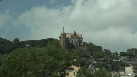 House hill mansion curious tower vane Barcelona modernism clouds sky Stock Footage 327207076