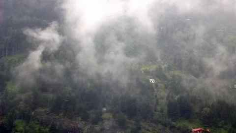 House on a hillside in the clouds Stock Footage 95329369