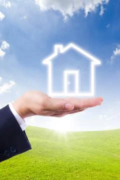 House icon on hand Stock Photos