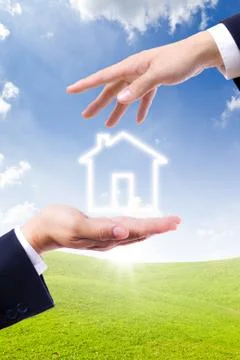 House icon on hand Stock Photos
