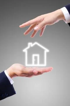 House icon on hand Stock Photos