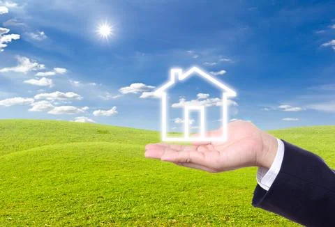 House icon on hand Stock Photos