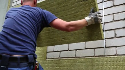 House insulation - insulating house facade with mineral rock wool Stock Footage 64840773