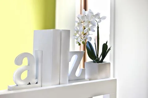 House interior decoration using 3d letters and flowering plant Stock Photos
