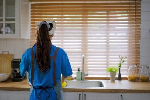 House keeper clean kitchen. Stock Photos