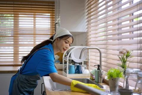 House keeper clean kitchen. Stock Photos