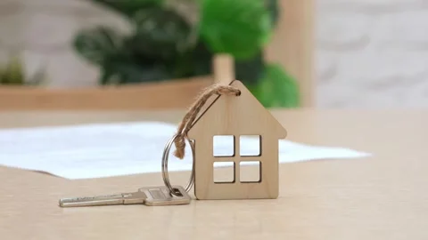 House key and contract on table. Mortgage, home loan, insurance, real estate Stock Footage 274203511