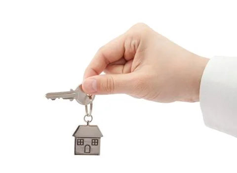 House key in hand with clipping path Stock Photos