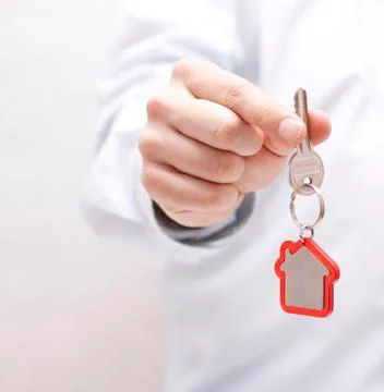 House key in hand Stock Photos