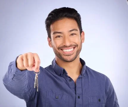 House keys, happy and portrait of a man in a studio with confidence after buying Stock Photos