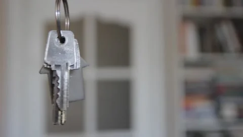 House keys with keychain rotate in the background Video stock 106480968